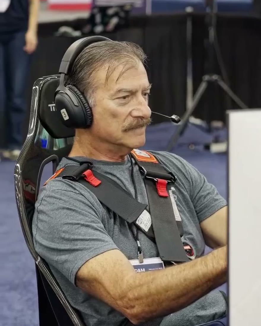 A guest enjoying a Trackside racing simulator